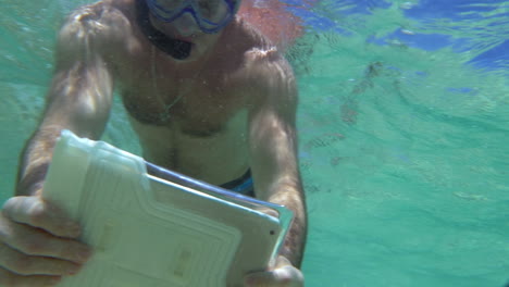 Man-Shooting-Coral-Reef-with-Tablet-PC