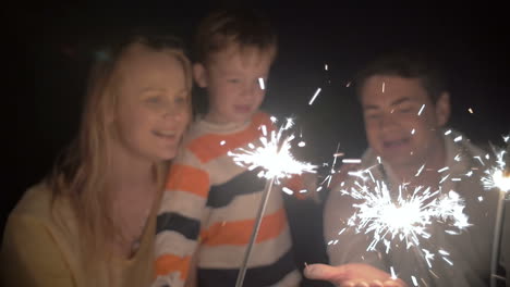 Son-and-His-Parents-Catching-Sparkles-of-a-Bengale-Fire