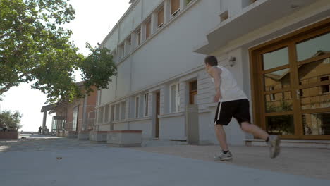 Teenager-performing-parkour-in-the-street