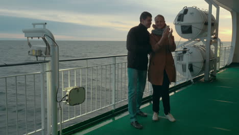 Happy-Couple-Taking-Selfie-on-the-Ferry-Deck