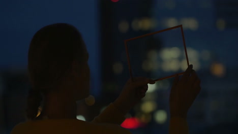 Woman-Holding-Transparent-Tablet