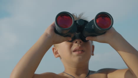 Child-exploring-the-world-with-binoculars