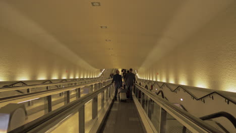 People-on-flat-escalator-at-the-airport-in-Paris-France