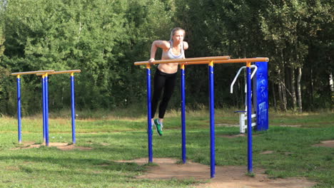 Girl-training-on-parallel-bars