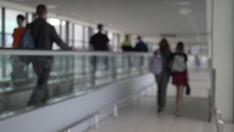 People-walking-through-the-airport-passageway