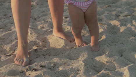 Mum-and-baby-daughter-having-great-time-on-the-beach