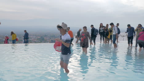 Tourists-exploring-travertine-terraces-in-Pamukkale-Turkey