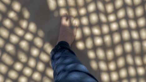 Man-feet-walking-on-the-sand