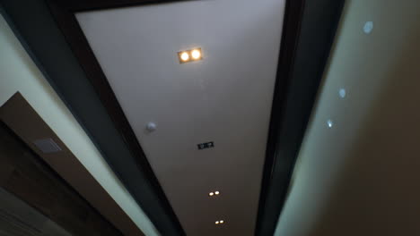 View-to-the-ceiling-in-the-hall-of-apartment-block