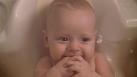 Smiling-baby-girl-bathing