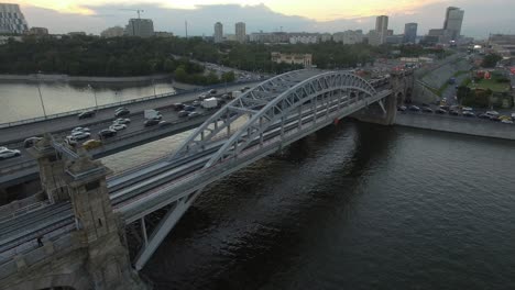 An-aerial-view-of-a-road-bridge-and-a-long-highway-with-busy-traffic