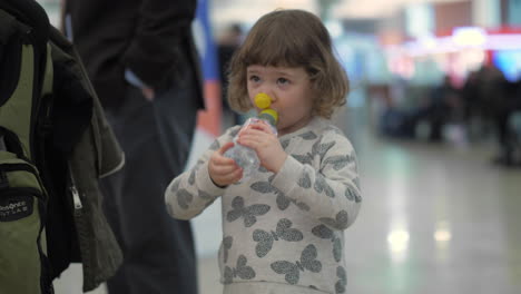 Thirsty-little-girl-at-the-airport