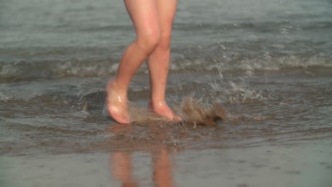 Kid-feet-splashing-water-fun-at-the-seaside