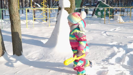 Happy-kid-enjoying-the-walk-in-deep-snow