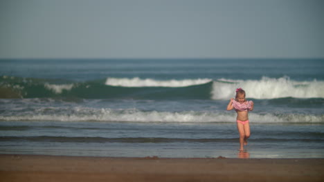 Joyful-and-playful-kid-on-the-ocean-beach