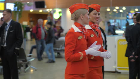 Pretty-cheerful-Aeroflot-stewardesses-in-red-uniform