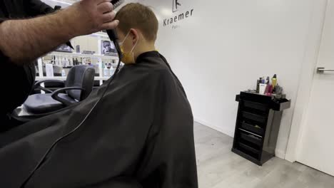 Boy-at-the-barber-shop-getting-new-hairstyle
