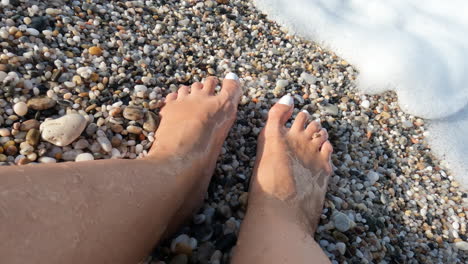 Womans-feet-in-sea-foam