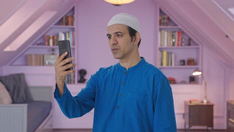 Muslim-man-talking-on-video-call