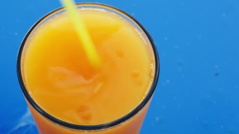 Stirring-up-ice-in-fruit-juice