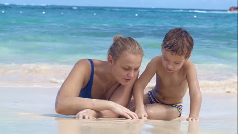 Mother-and-son-playing-on-the-beach