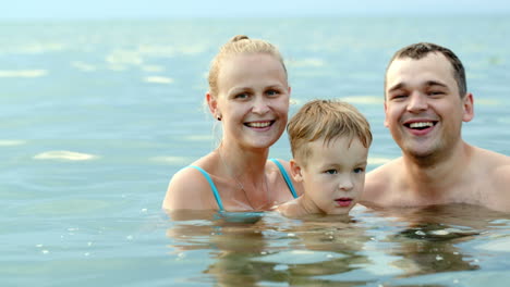 Happy-family-of-three-in-the-sea