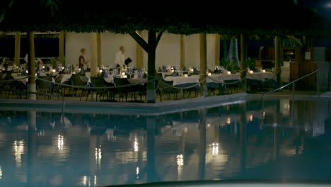 Restaurant-by-swimming-pool-on-resort-in-the-evening