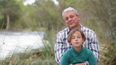 Grandchild-with-grandfather-in-quiet-countryside