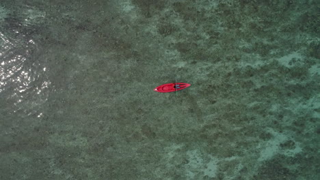 Aerial-view-of-red-boat-sailing