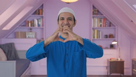 Happy-Muslim-man-showing-heart-sign