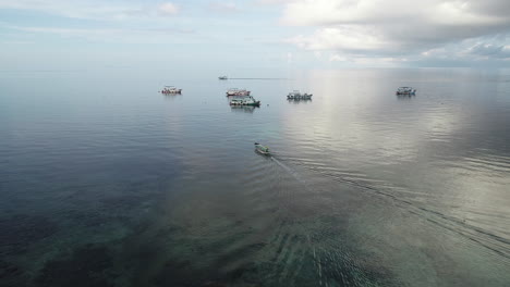 Boat-gliding-towards-anchored-ships-on-Tao-Island