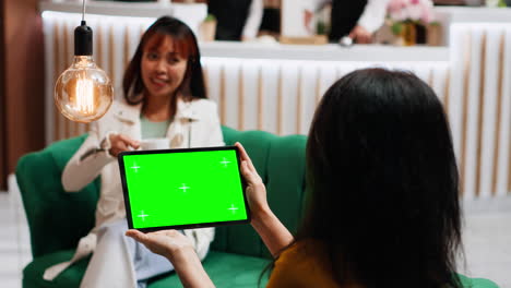 Traveler-checking-isolated-greenscreen-template-on-tablet