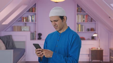 Angry-Muslim-man-chatting-on-phone