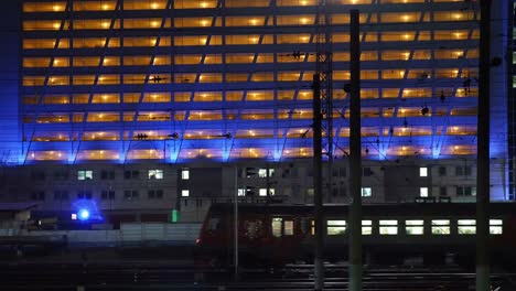 Passenger-train-in-city-at-night