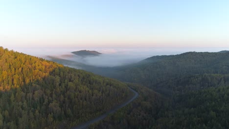 Aerial-View-of-Mountain-Landscape-and-Foggy-Valley