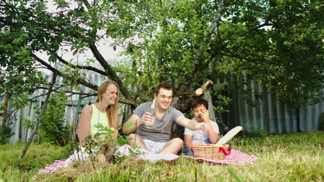 Parents-with-their-son-having-picnic-in-the-courtyard