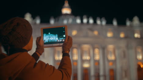 Making-touch-pad-photos-of-night-St-Peters-Basilica