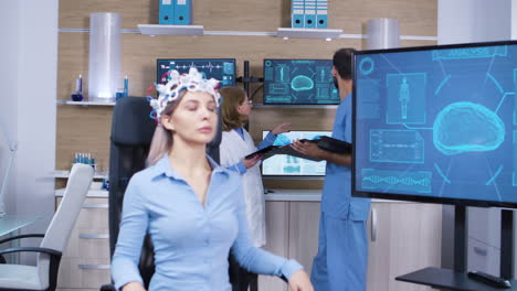Female-patient-falling-asleep-while-wearing-brain-activity-scanner