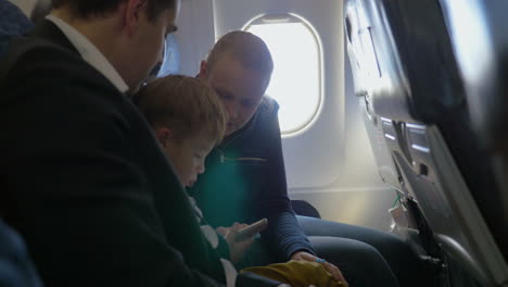 Parents-and-little-son-traveling-by-air