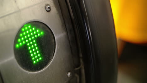 Green-arrow-indicator-on-working-escalator