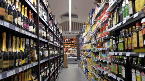 Section-with-alcoholic-drinks-and-food-in-supermarket