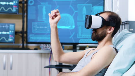 Patient-with-virtual-reality-goggles-in-a-modern-facility-for-brain-research