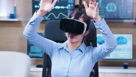 Female-scientist-using-virtual-reality-goggles-in-a-neurology-clinic