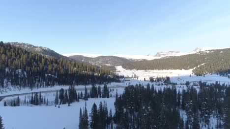 Aerial-footage-of-snowy-mountain-valley