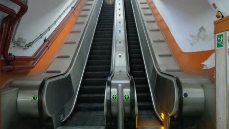 Empty-underground-escalator-moving-up
