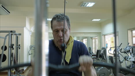 Mature-man-working-out-on-pulldown-machine