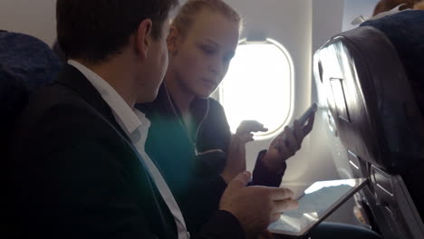Young-people-making-agreement-in-the-plane