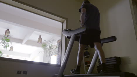 Man-in-the-gym-exercising-on-treadmill