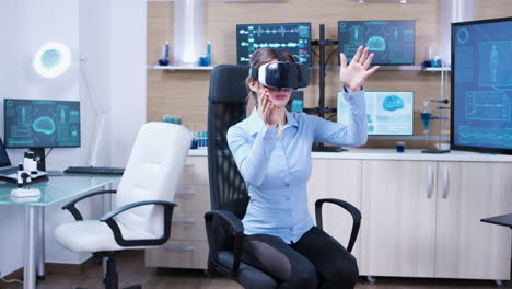 Female-physician-using-virtual-reality-goggles-in-a-futuristic-clinic