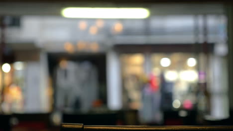 Defocused-view-of-city-street-through-the-cafe-window